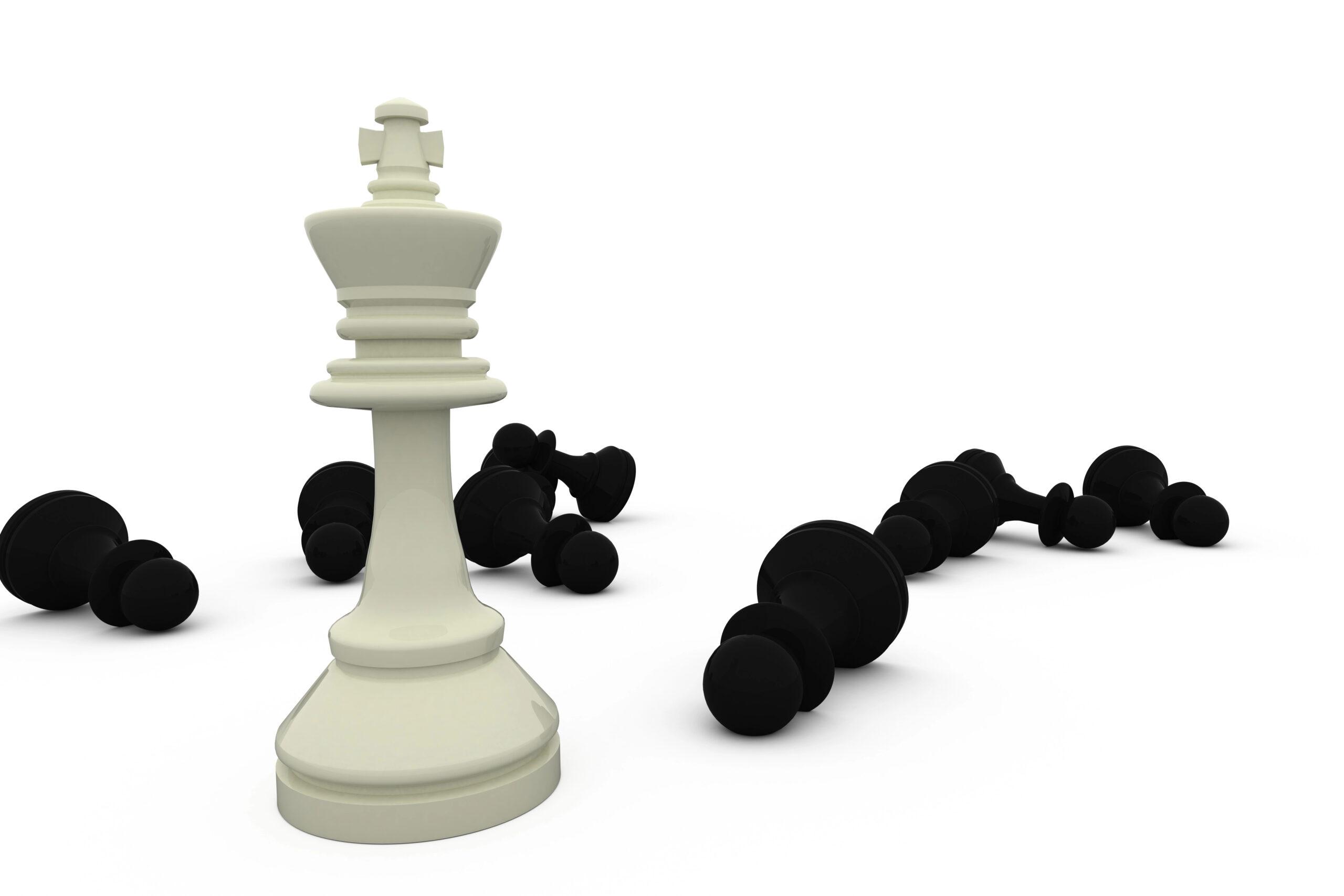 Header image of a white chess king over multiple black pieces demonstrating the article topic of application whitelisting